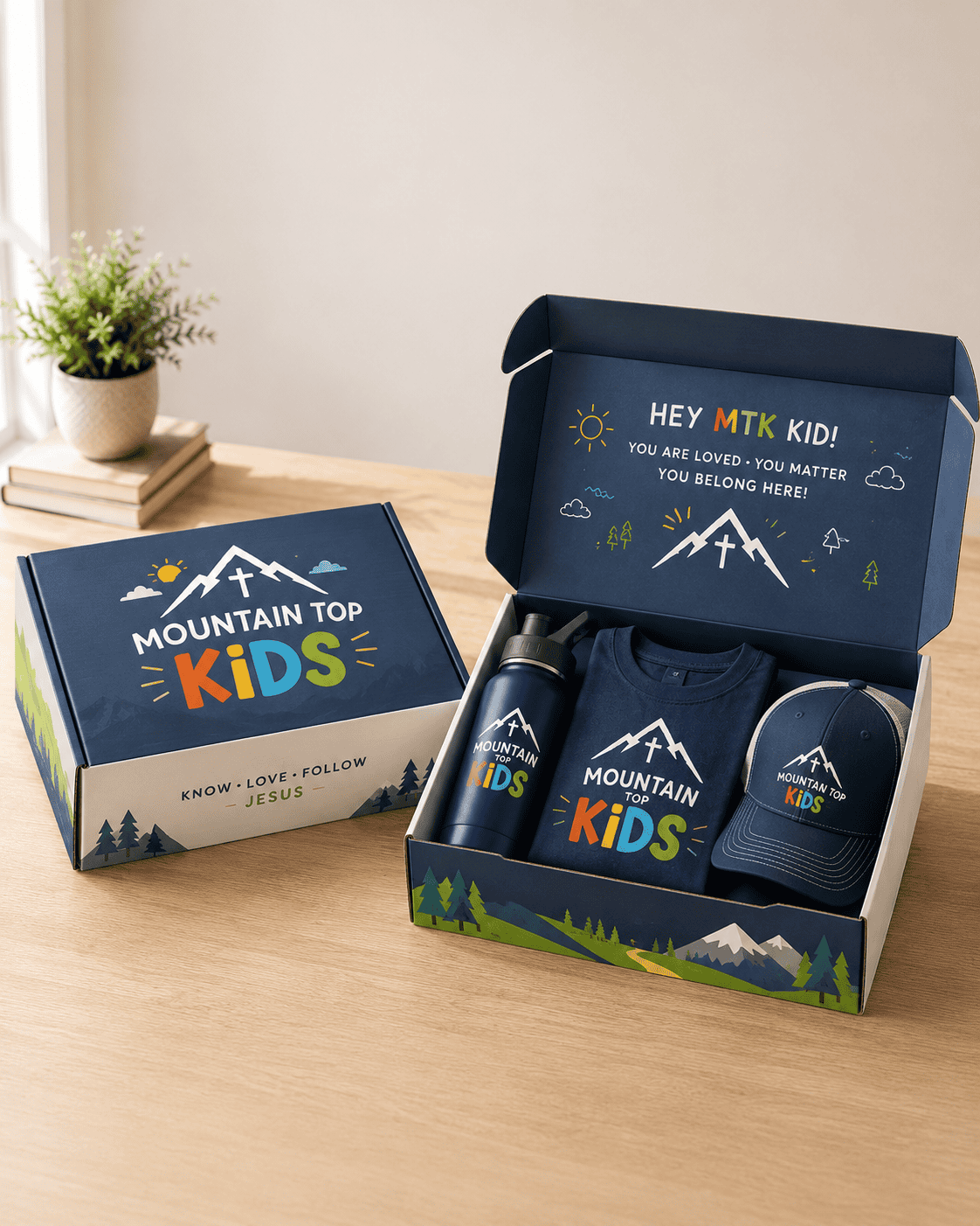 Mountain Top Kids branded appreciation boxes with T-shirt, hat and water bottle